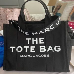 Small Canvas Tote featuring screen printed LOGO and top zipper closure